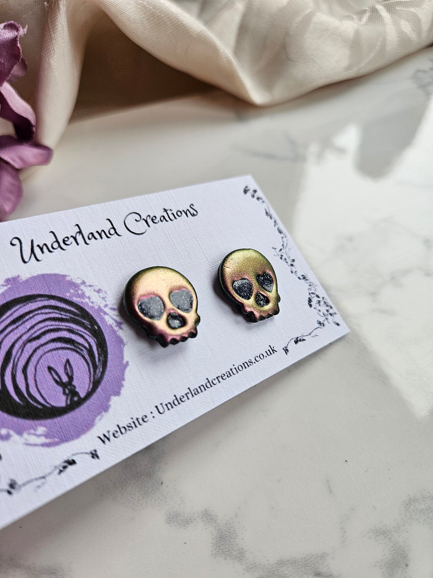 Skull Stud Earrings in Metallic Pink/Gold