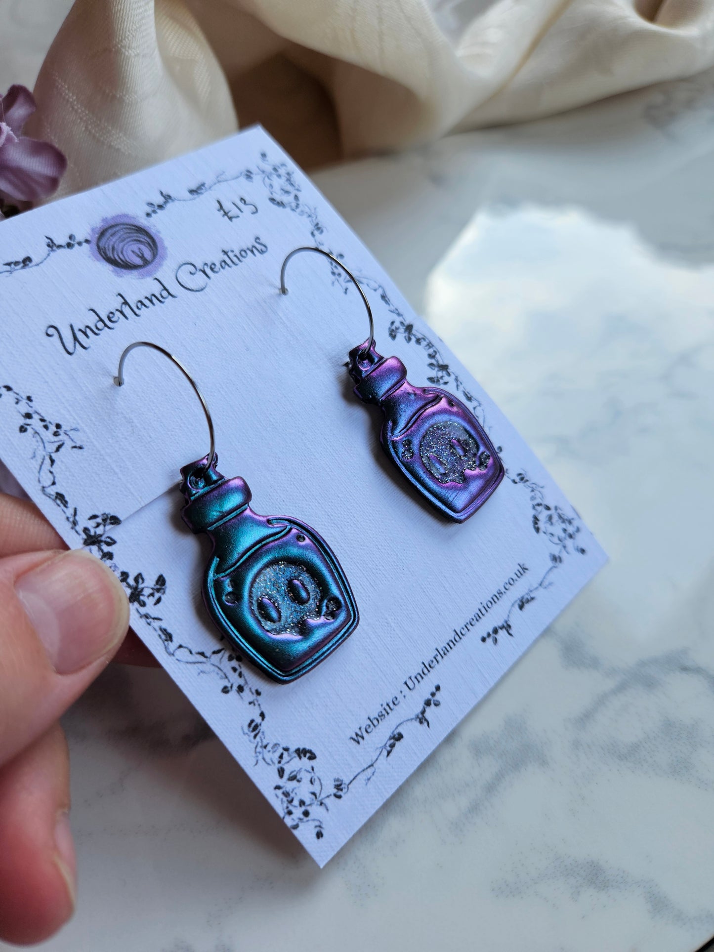 Skull Potion Bottles in Metallic Purple/Blue
