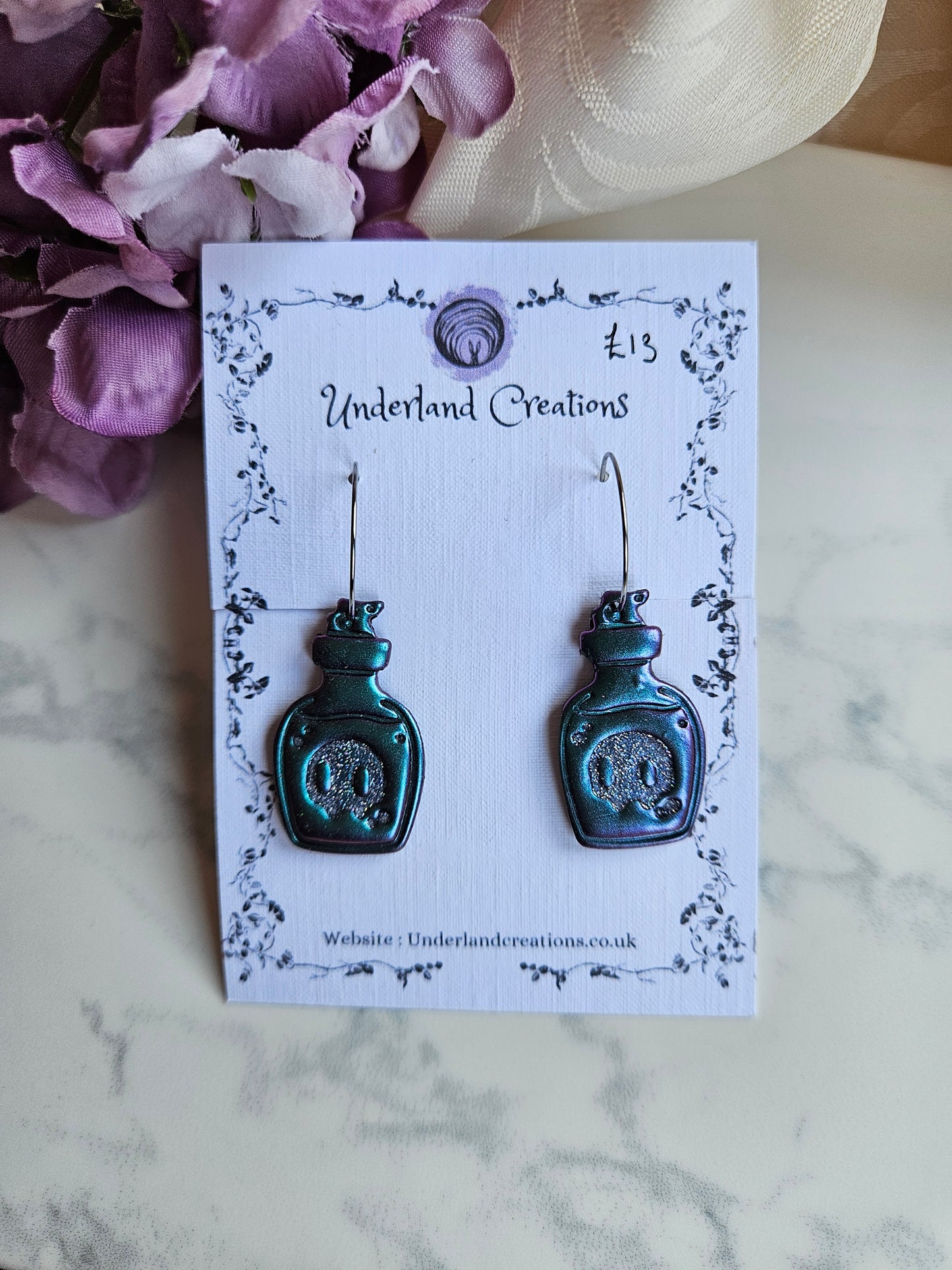 Skull Potion Bottles in Metallic Purple/Blue