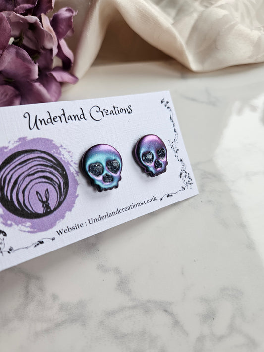 Skull Stud Earrings in Metallic Purple/Blue